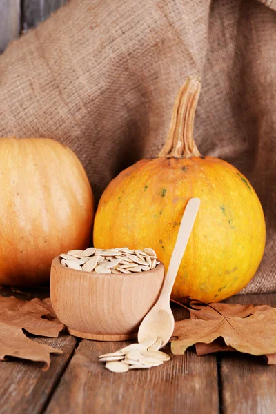 Pumpkin seeds oil in glass sauce-boat — Stock Photo, Image