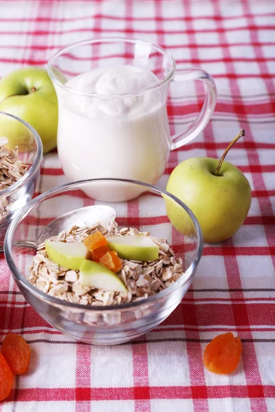 Oatmeal in bowls, yogurt, apples — Stock Photo, Image