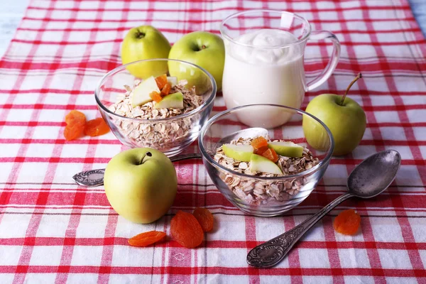 Oatmeal in bowls, yogurt and apples — Stock Photo, Image