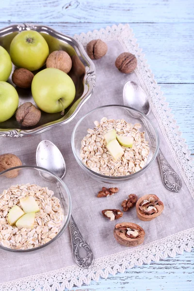 Oatmeal in bowls, yogurt, apples — Stock Photo, Image