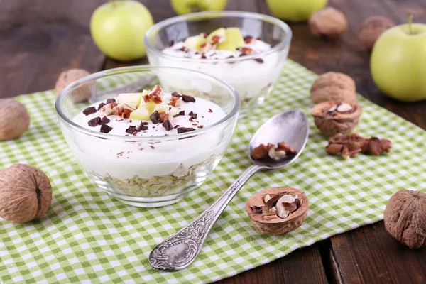 Oatmeal with yogurt in bowls, apples and walnuts — Stock Photo, Image