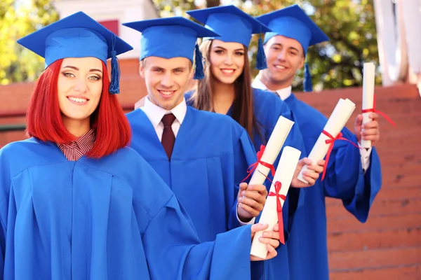 Students with diplomas — Stock Photo, Image