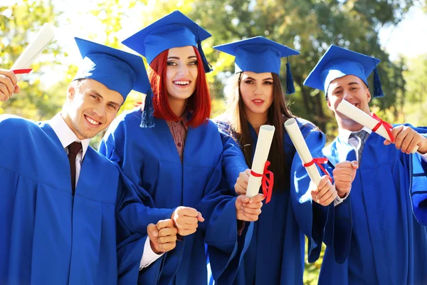 Students with diplomas — Stock Photo, Image