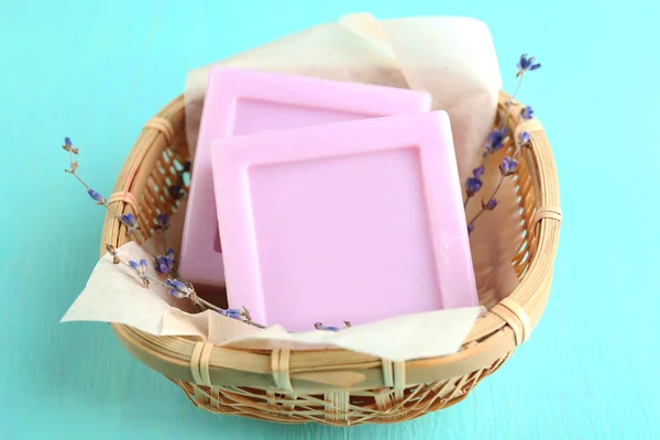 Bars of natural soap with dried lavender in wicker basket — Stock Photo, Image