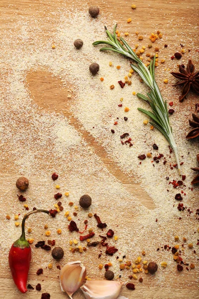 Kryddor på bordet med sked silhuett — Stockfoto