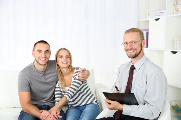 Young happy couple after therapy session with family psychologist