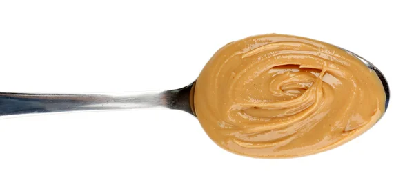 Creamy peanut butter in spoon — Stock Photo, Image