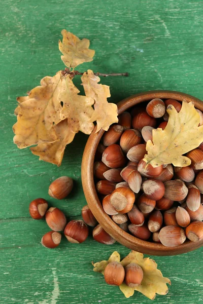 Hazelnuts in wooden bowl — Stock Photo, Image