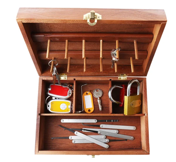 Keys and lock picks in wooden box — Stock Photo, Image