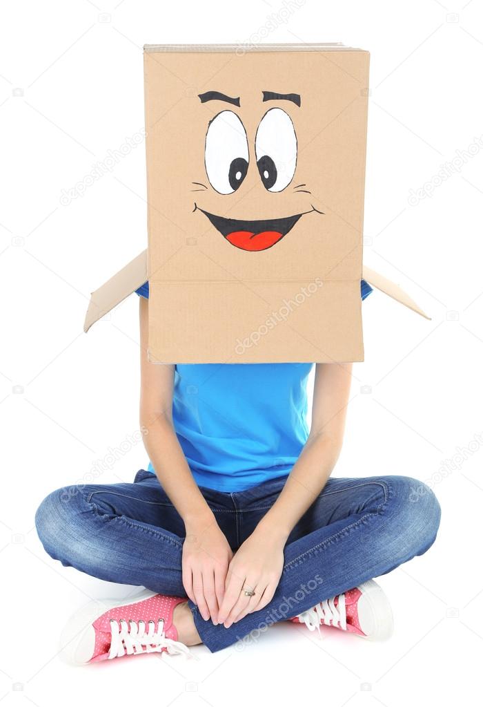 Woman with cardboard box on her head with happy face