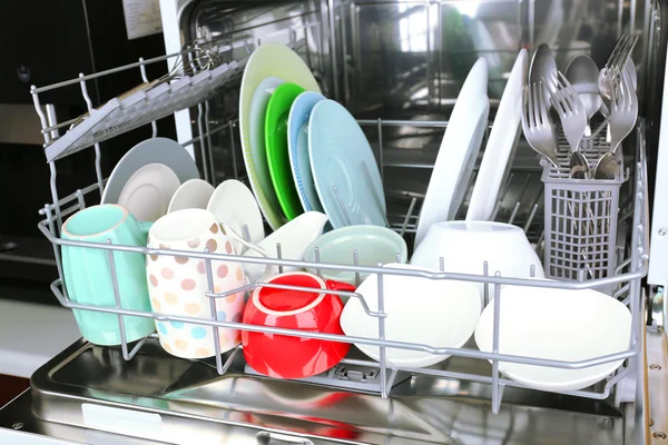 Open dishwasher with utensils — Stock Photo, Image