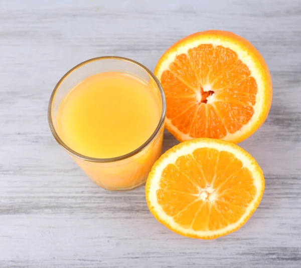 Glass of juice with fresh orange — Stock Photo, Image