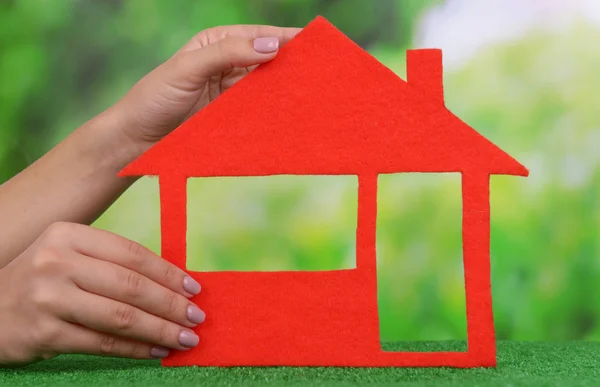 Woman hands holding paper house — Stock Photo, Image