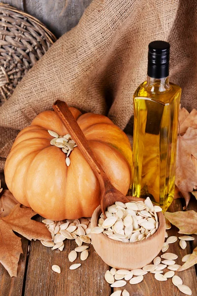 Pumpkin seed oil in glass bottle — Stock Photo, Image