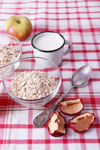Oatmeal, mug of milk and apples — Stock Photo, Image