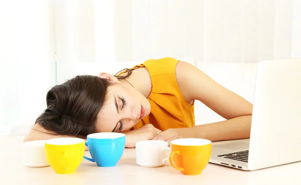 Tired man with many cups — Stock Photo, Image