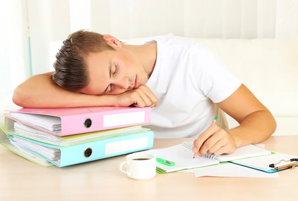 Tired man with many folders — Stock Photo, Image