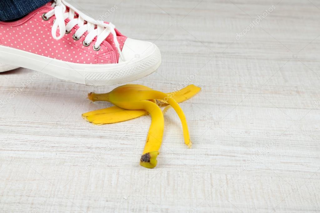 Shoe slips on banana peel Stock Photo by ©belchonock 57034385