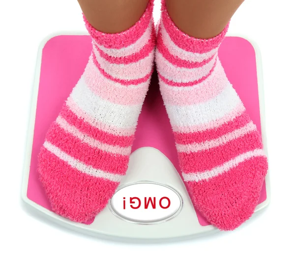 Feet on pink scales — Stockfoto