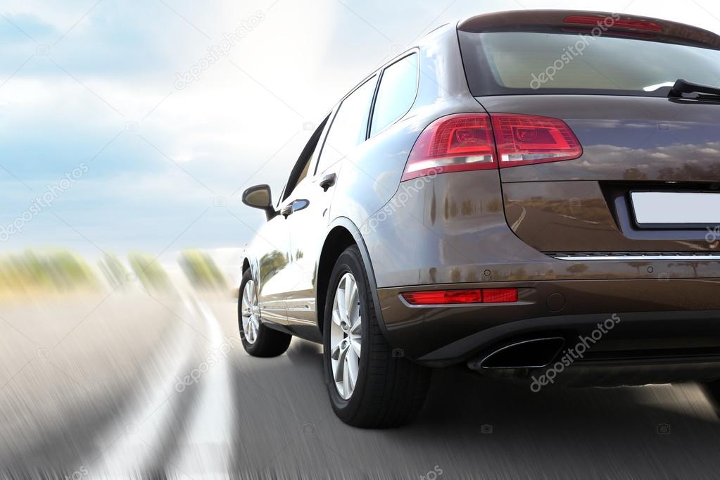 Modern car driving on road