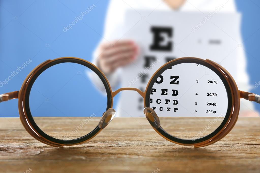 Vision concept. Eye glasses on wooden table