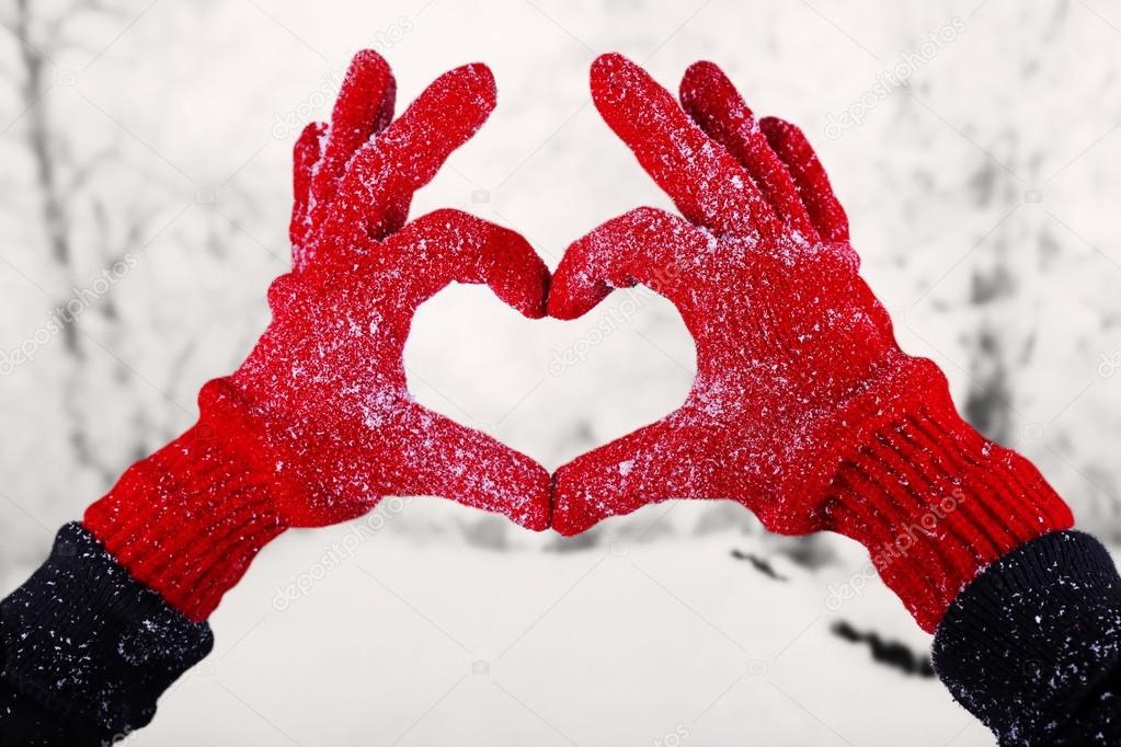 Woman's hands in red gloves