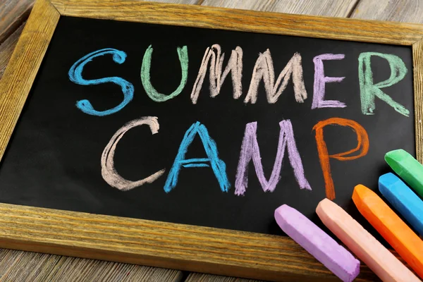 Summer camp written with chalk on chalkboard — Stock Photo, Image