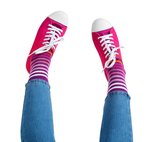 Legs in colorful socks and sneakers — Stock Photo, Image