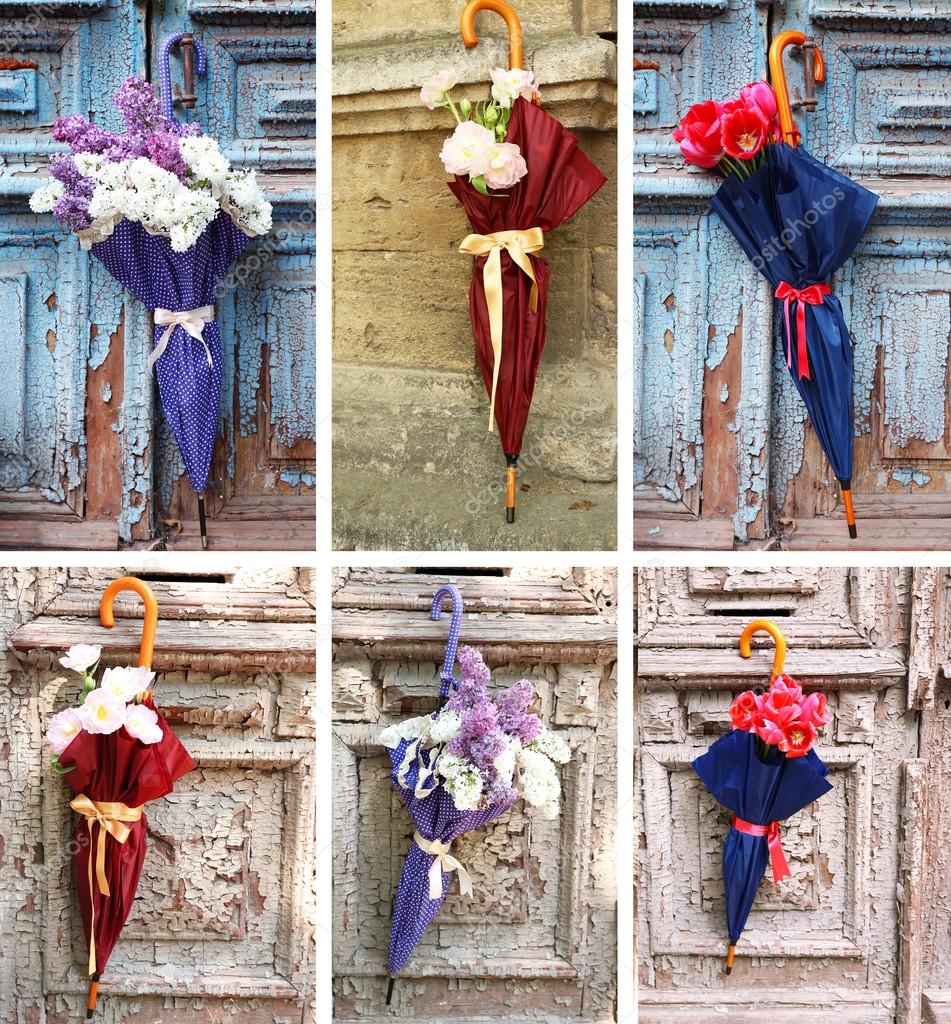 Umbrella concept. Beautiful flowers in umbrella on old wooden doors ...