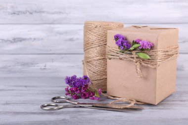 gift with flowers and decorative rope