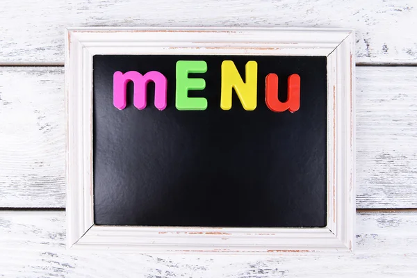 Inscription menu on chalkboard on table close-up — Stock Photo, Image