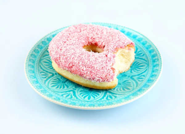 Donut mordido en la mesa — Foto de Stock