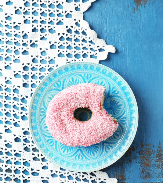 Bitten donut on table — Stock Photo, Image