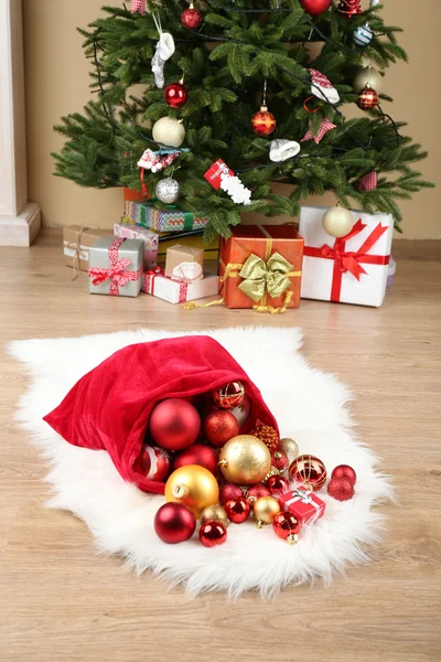 Red bag with Christmas toys — Stock Photo, Image