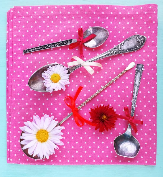 Metal spoons and flowers — Stock Photo, Image