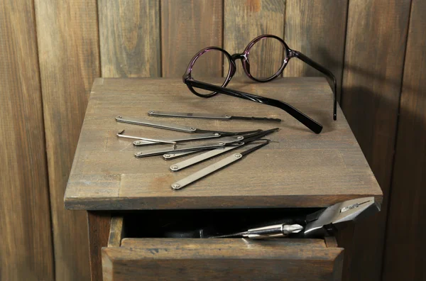 Lock picks on wooden table — Stock Photo, Image