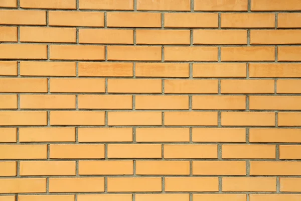 Orange brick wall close-up background — Stock Photo, Image