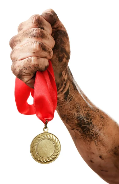 Guld medalj i hand — Stockfoto