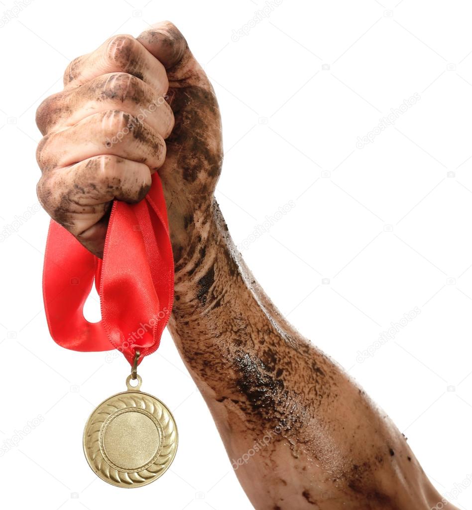 Golden medal in hand