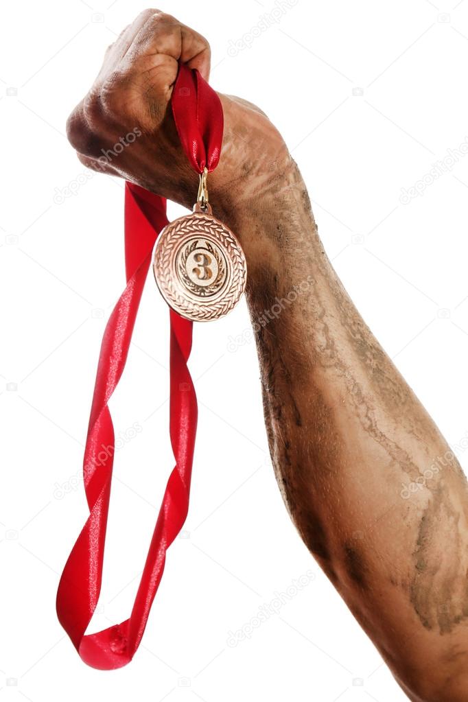 Golden medal in hand