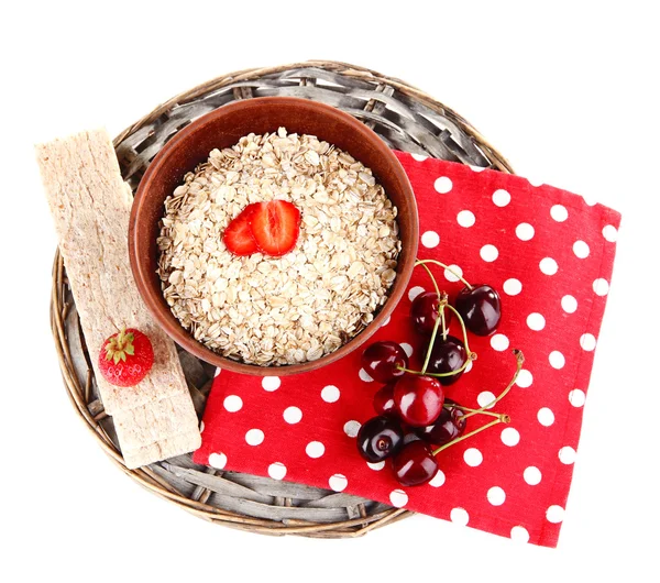 Big brown bowl with oatmeal and berries on a napkin isolated on white — Stock Photo, Image