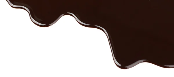 Melted chocolate dripping on white background — Stock Photo, Image