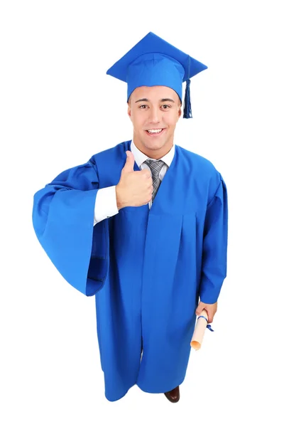 Graduado estudante vestindo chapéu de formatura e vestido — Fotografia de Stock