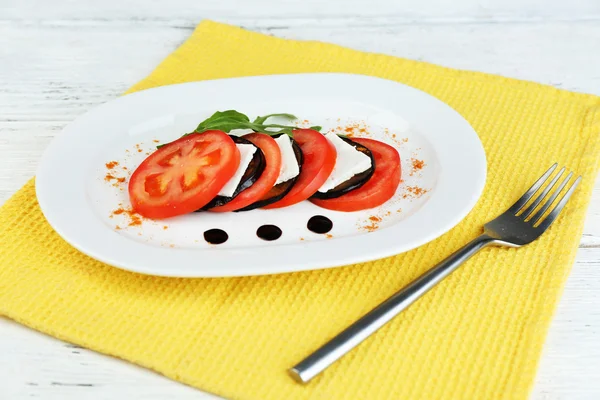 Eggplant salad with tomato and feta cheese — Stock Photo, Image