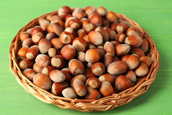 Hazelnuts on wicker mat — Stock Photo, Image