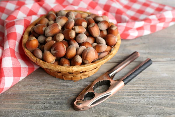 Hazelnuts in wicker basket — Stock Photo, Image