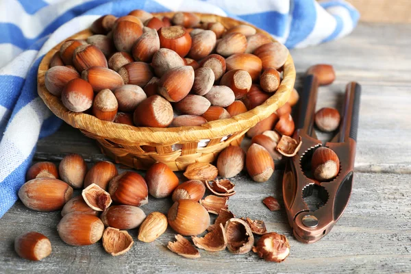 Hazelnuts in wicker basket — Stock Photo, Image