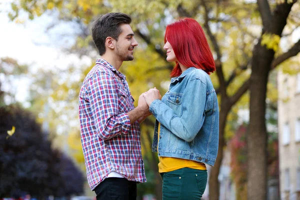 Loving couple in autumn park — Stock Photo, Image