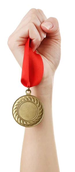 Medalha de ouro na mão isolada em branco — Fotografia de Stock