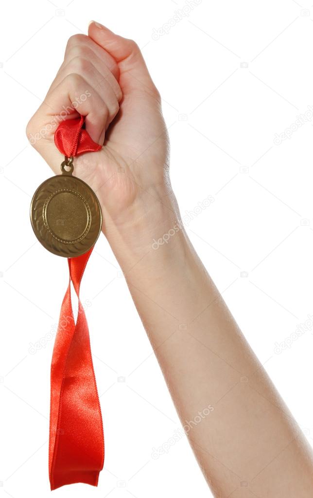 Golden medal in hand isolated on white